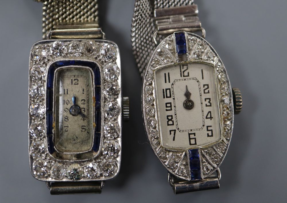 Two mid 20th century white metal (stamped platinum), sapphire and diamond set cocktail watches,